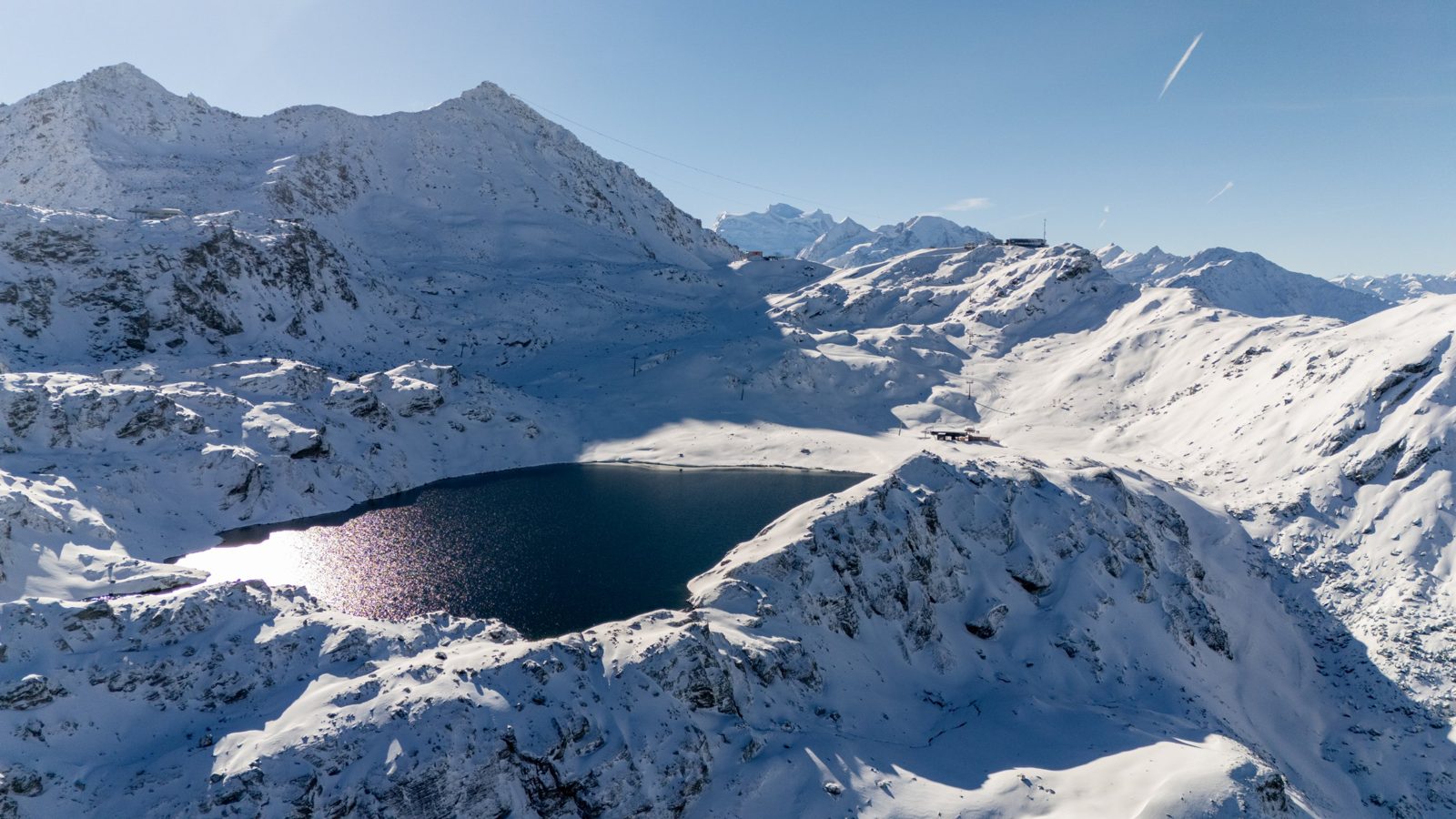 Aerial view of the Verbier ski area with Lac des Vaux and Mont Gelé under fresh snow