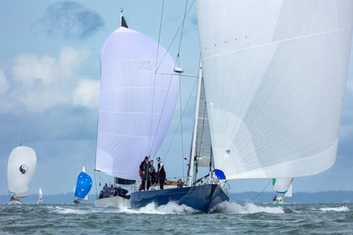 Race yacht running under spinnaker in the Solent